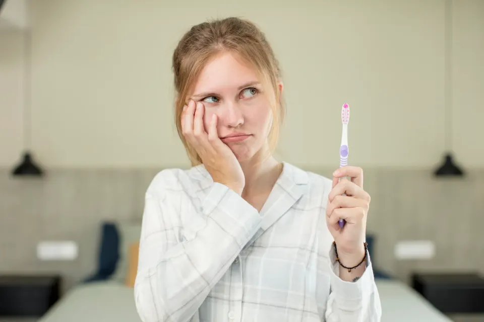 Dentist treating cavity with tooth-colored filling at Enclave Dental in Lake Mary FL