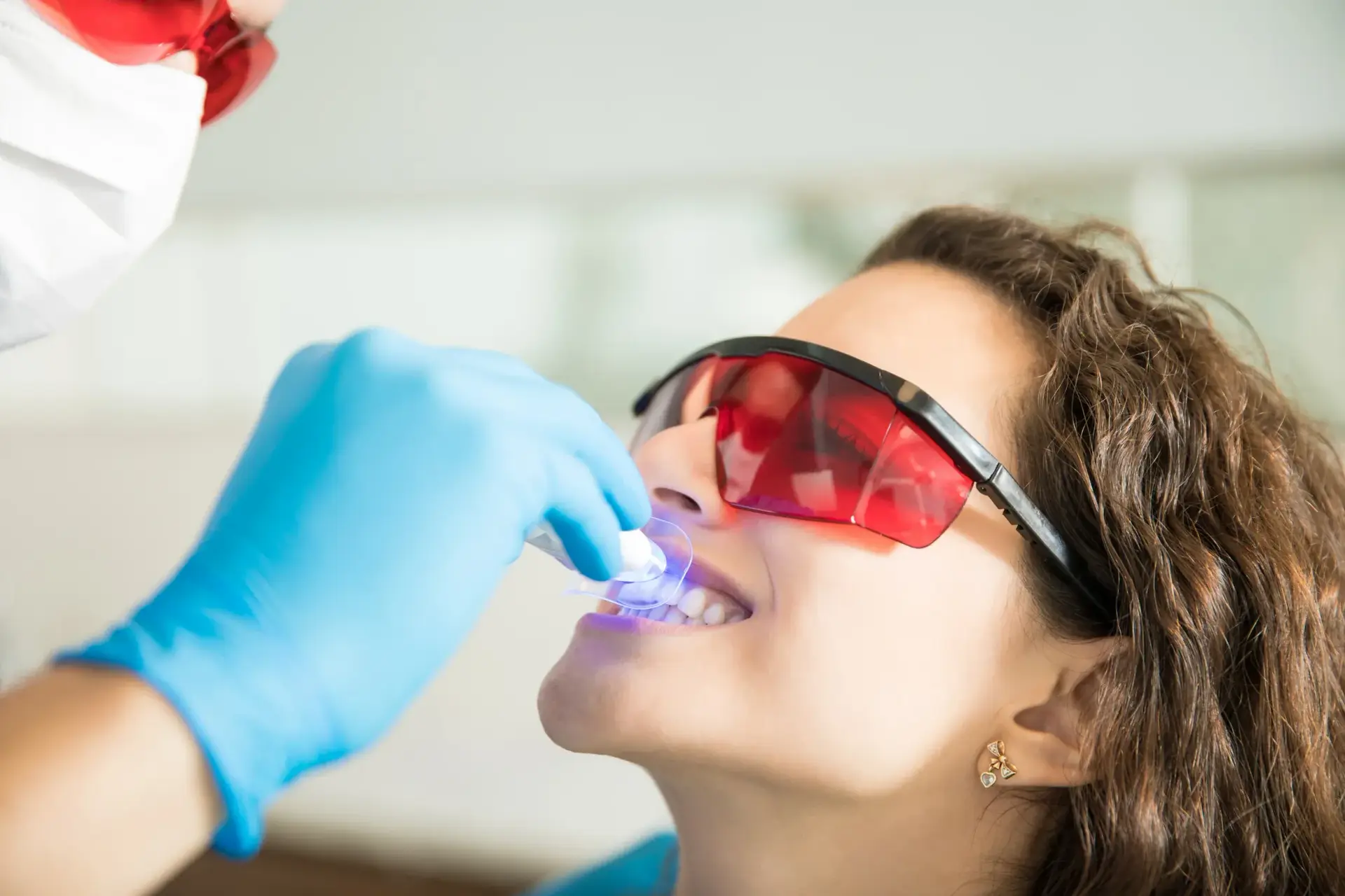 Patient receiving professional teeth whitening treatment at Enclave Dental in Lake Mary, FL
