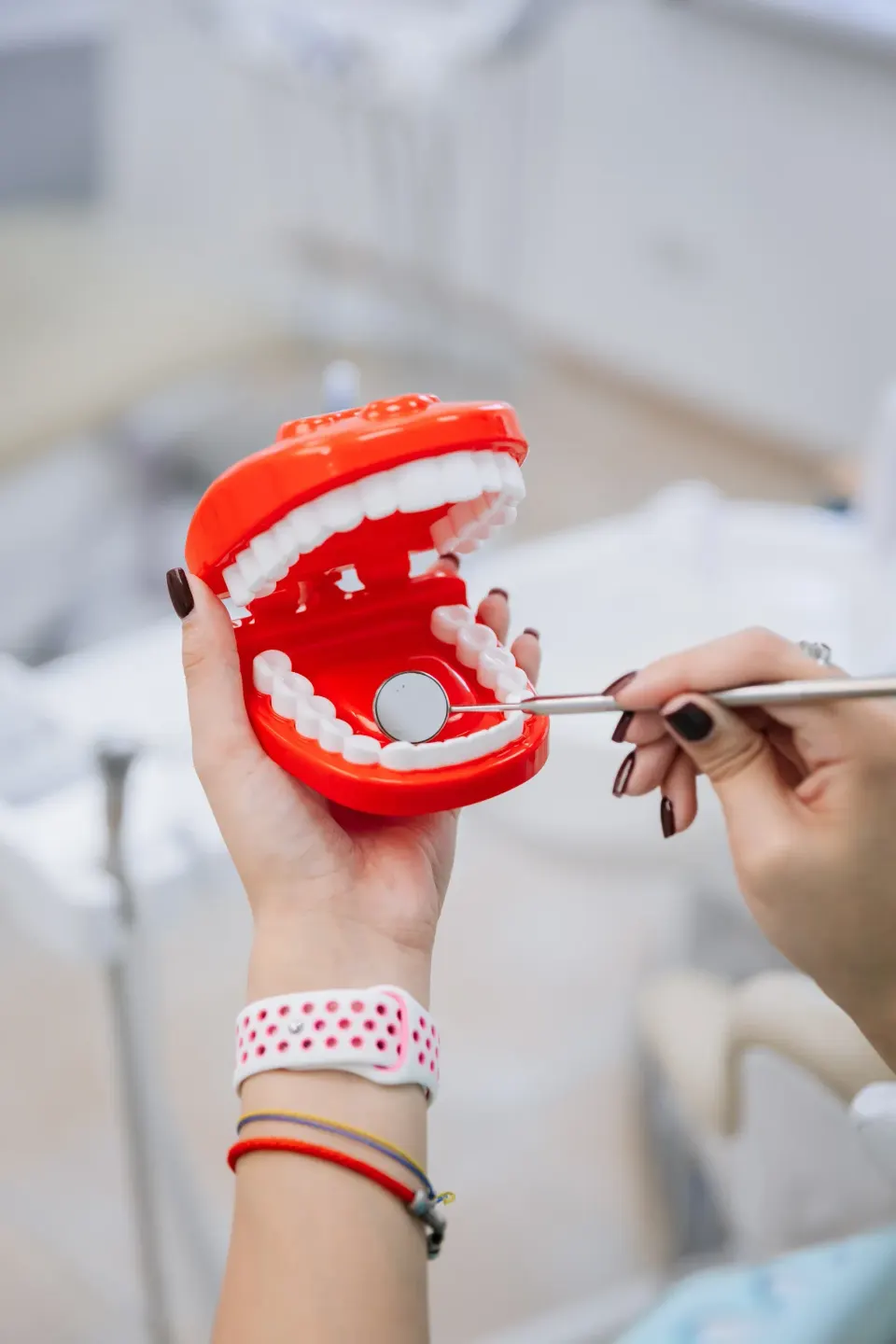 Periodontal probe measuring gum pocket depth at Enclave Dental