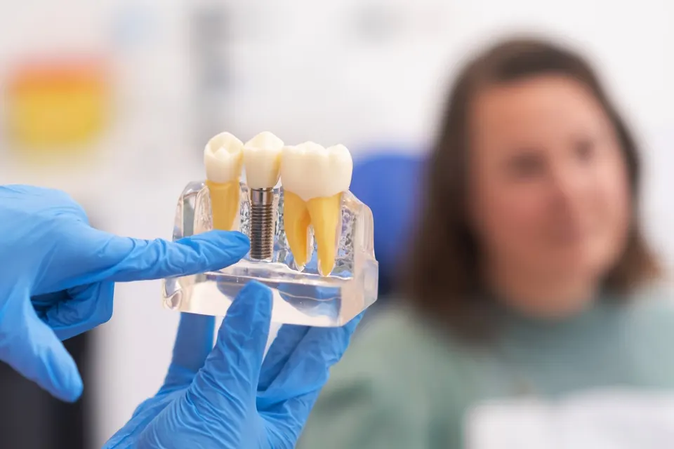 Patient receiving dental implant consultation at Enclave Dental in Lake Mary, FL