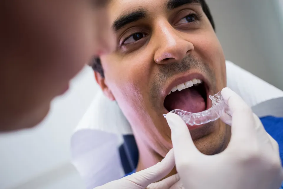 Patient smiling with Invisalign clear aligners at Enclave Dental in Lake Mary FL