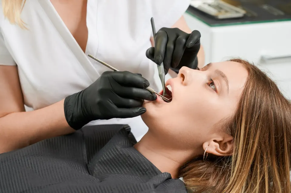 Dr. Shah performing a gentle tooth extraction at Enclave Dental in Lake Mary, FL