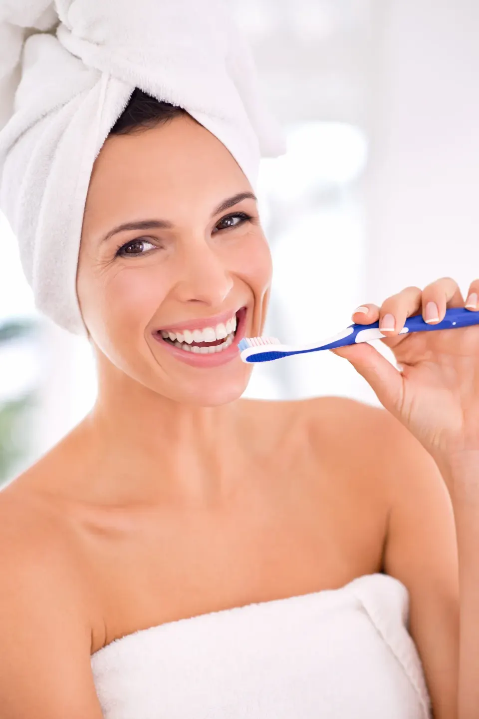 Patient smiling after professional teeth cleaning at Enclave Dental Lake Mary