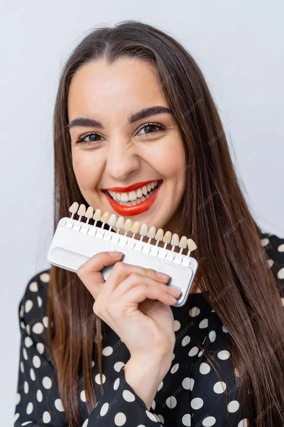 Porcelain veneer shells and dental tools used at Enclave Dental Lake Mary
