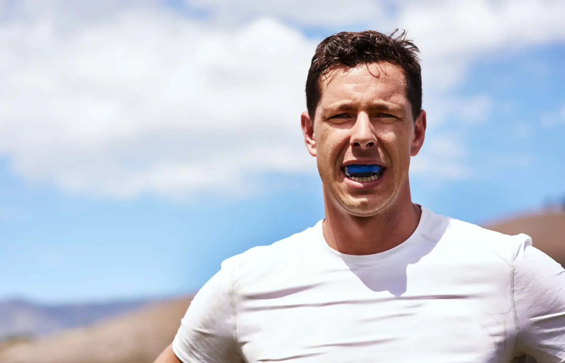 Athlete wearing a custom sports mouth guard — Enclave Dental Lake Mary FL