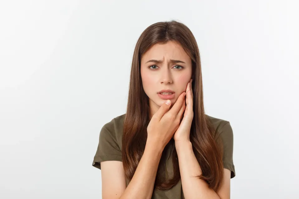Dental hygienist performing a professional teeth cleaning on a patient in a modern dental office
